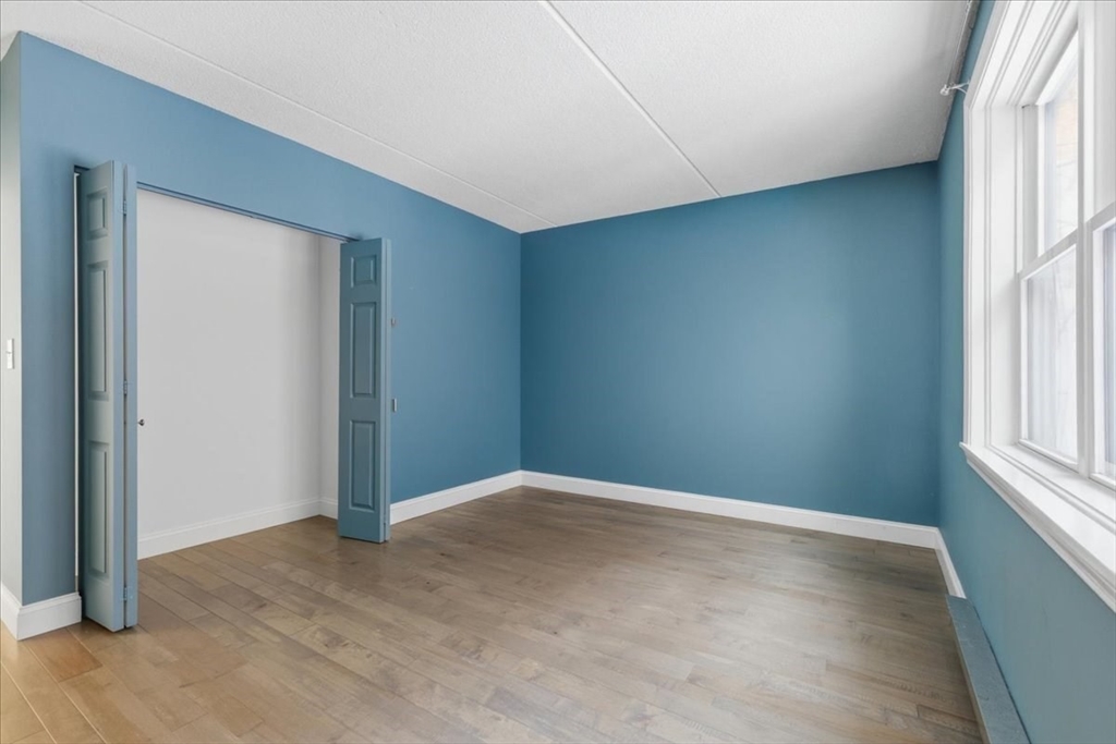 7A Eugene Circle, Unit B Boston, MA 02130 - Photo 19 of 42 an empty room with windows