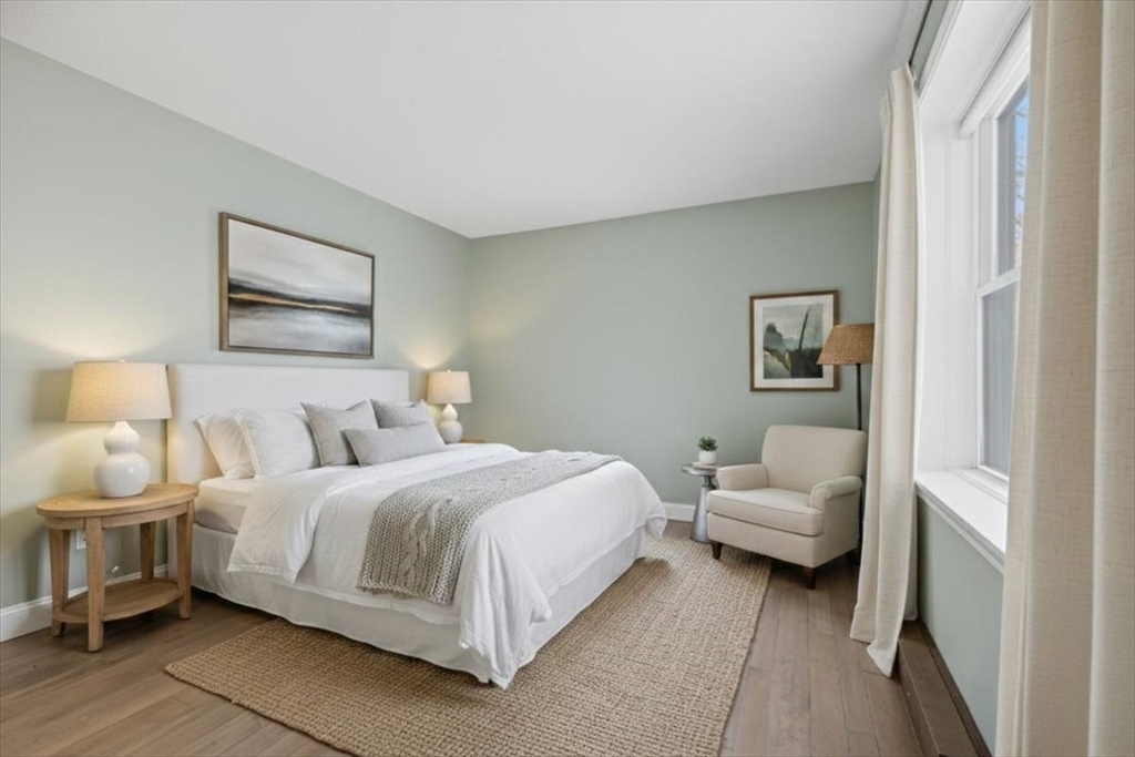 7A Eugene Circle, Unit B Boston, MA 02130 - Photo 21 of 42 a bedroom with a bed and a couch