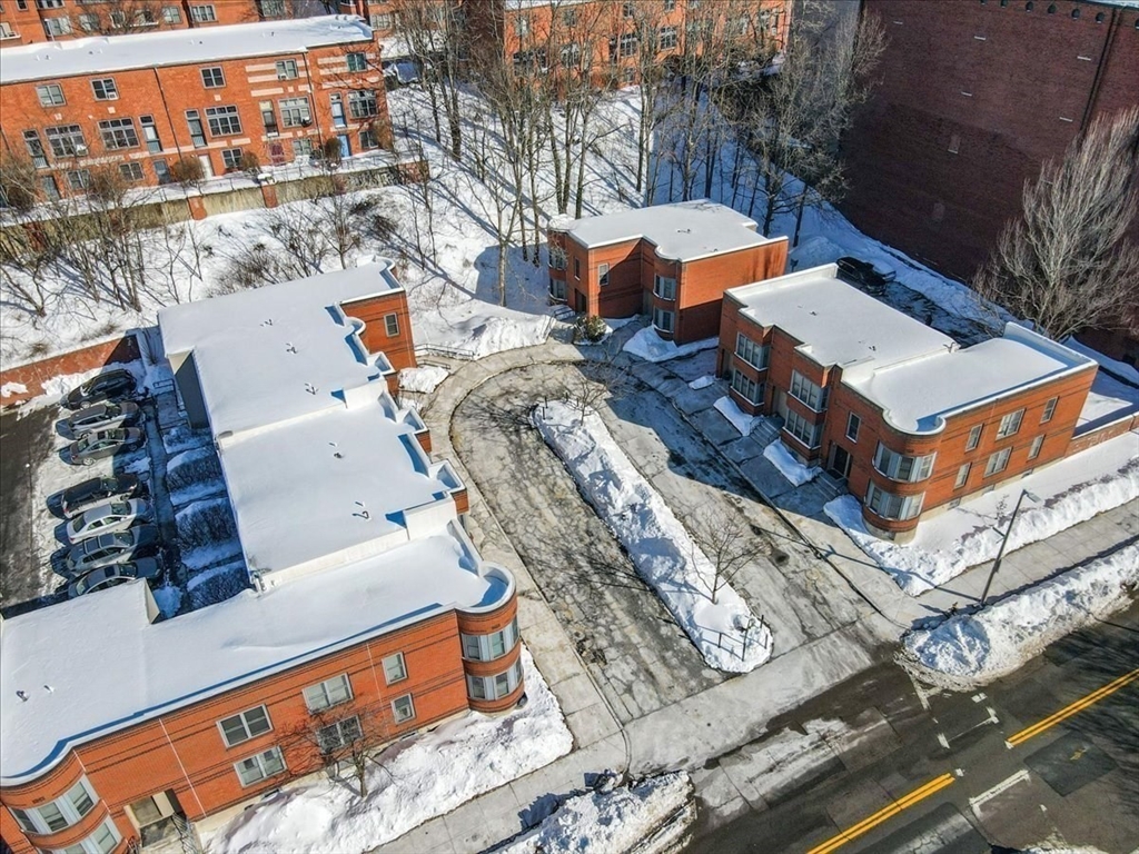 7A Eugene Circle, Unit B Boston, MA 02130 - Photo 28 of 42 an aerial view of a house with a yard and balcony