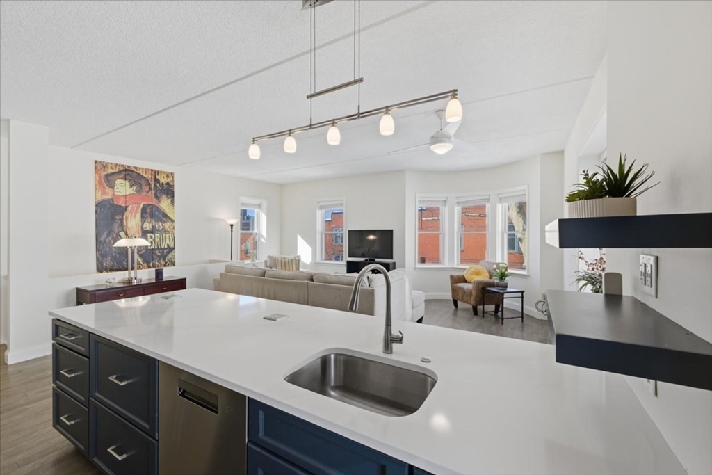 7A Eugene Circle, Unit B Boston, MA 02130 - Photo 7 of 42 a kitchen with a sink and a refrigerator