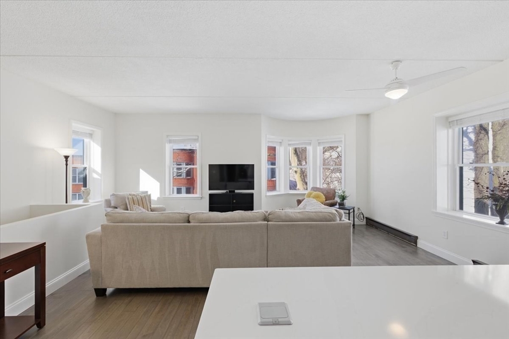 7A Eugene Circle, Unit B Boston, MA 02130 - Photo 8 of 42 a living room with furniture and a flat screen tv