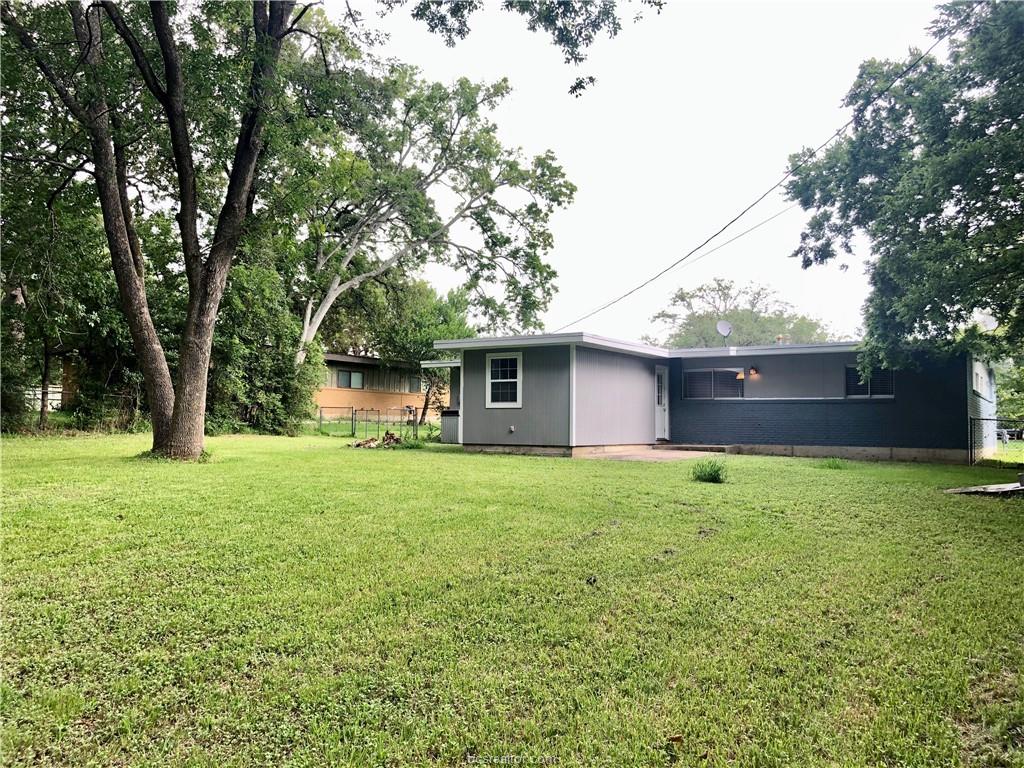 807 Vine Street Bryan, TX 77802 - Photo 16 of 17 a backyard of a house with lots of green space