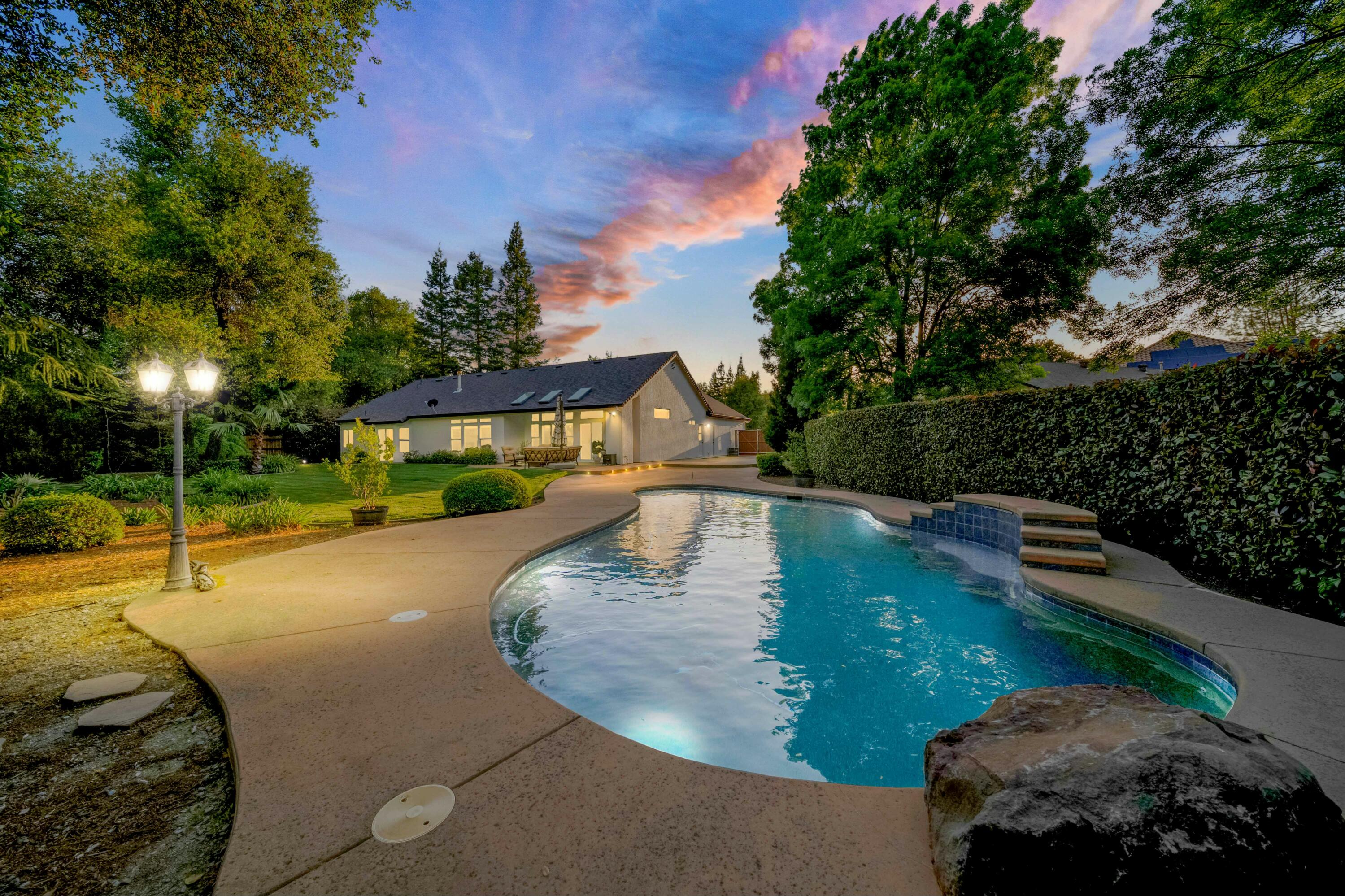4045 Mt Whitney Way Redding, CA 96002 - Photo 1 of 78 a view of a swimming pool with a yard