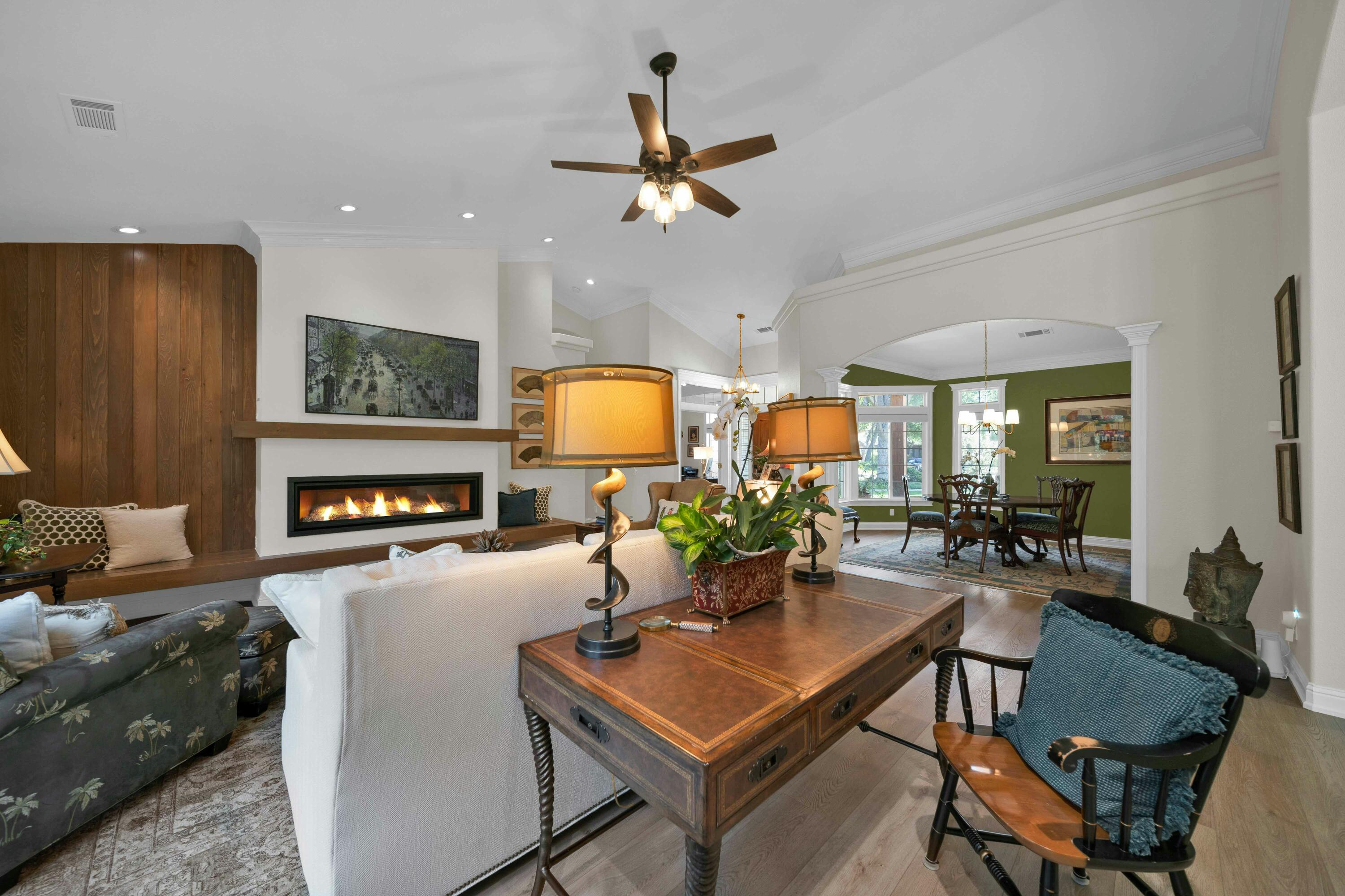 4045 Mt Whitney Way Redding, CA 96002 - Photo 11 of 78 a living room with fireplace furniture and a chandelier