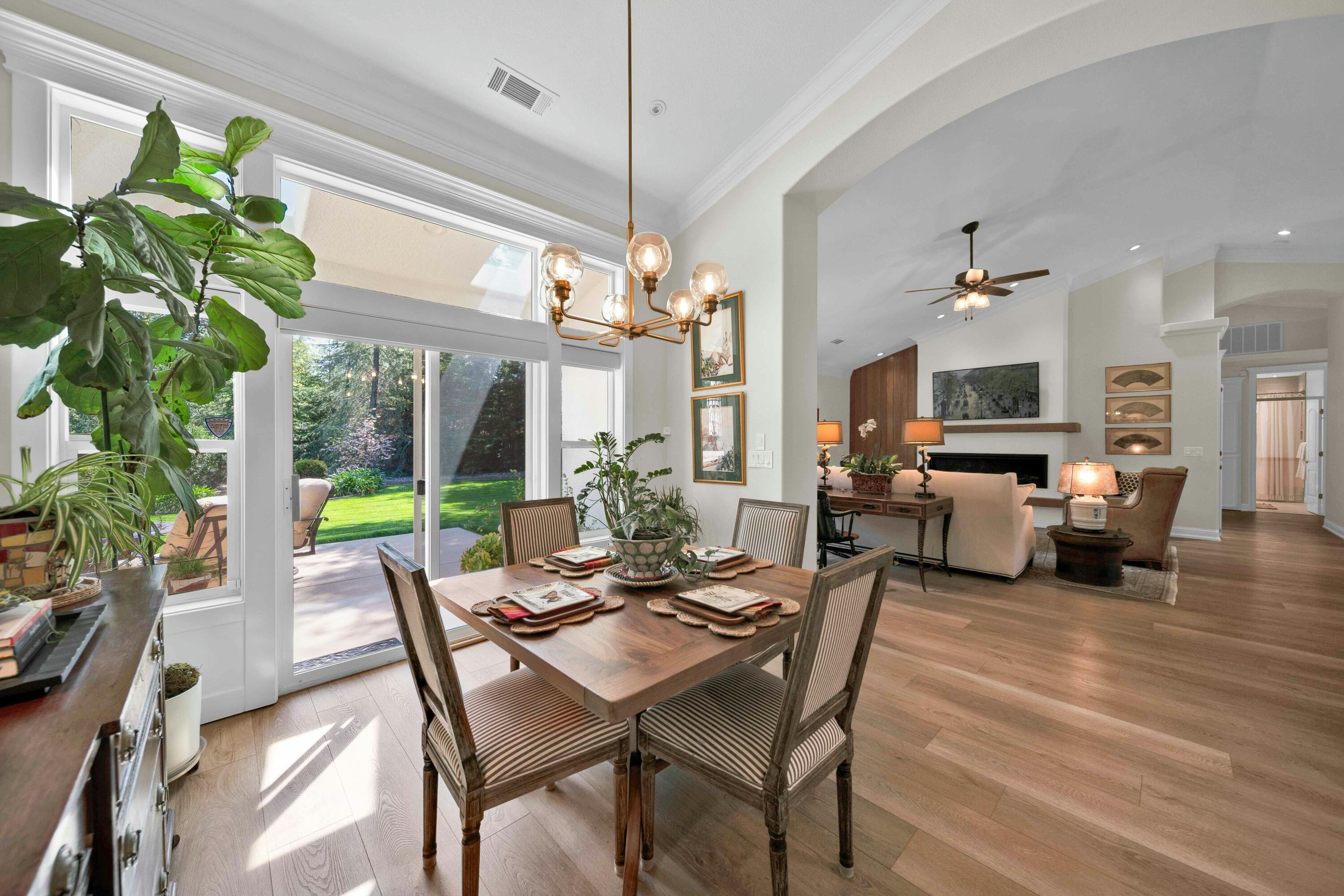 4045 Mt Whitney Way Redding, CA 96002 - Photo 23 of 78 a dining room with furniture a chandelier and a rug