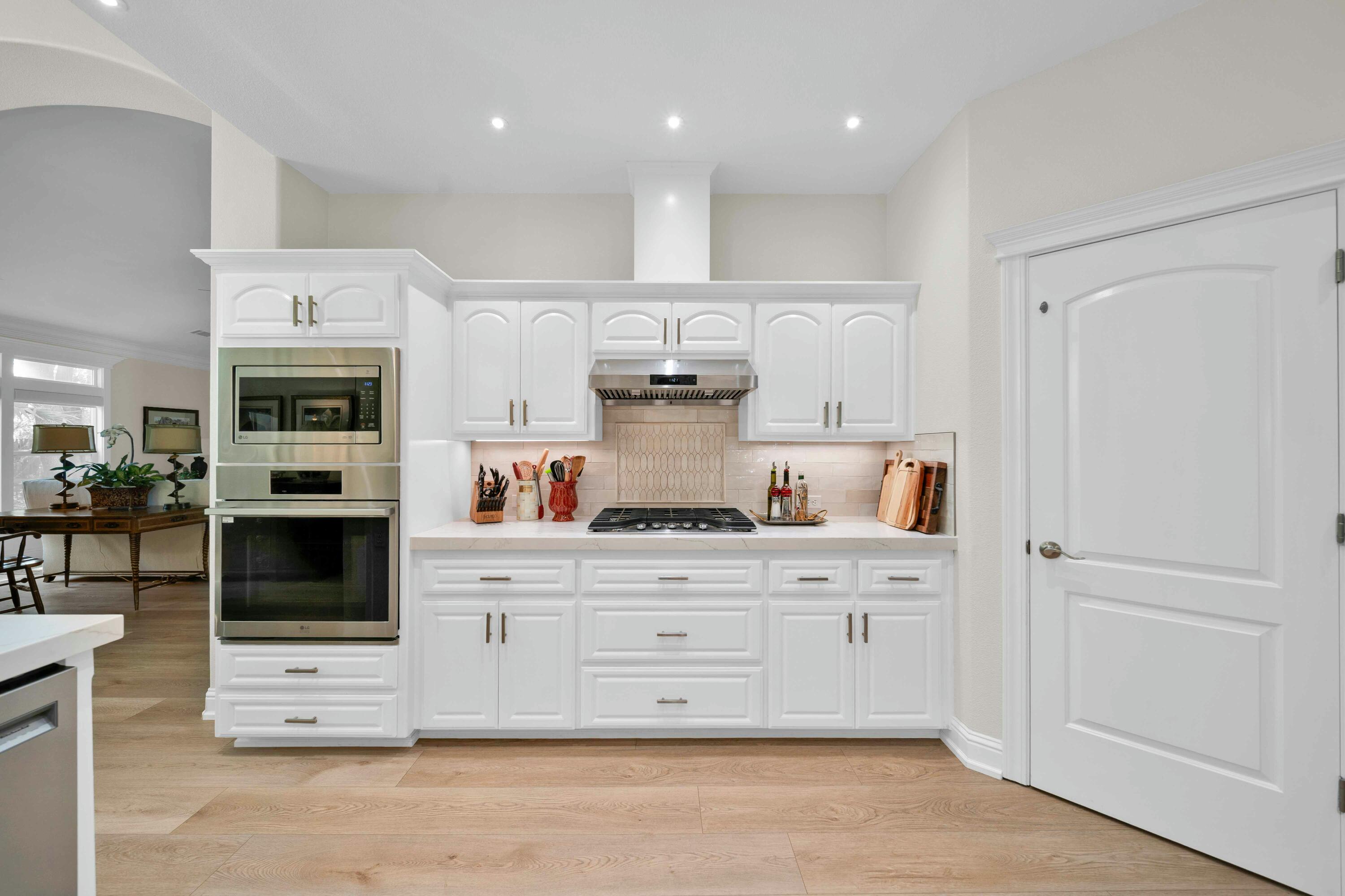 4045 Mt Whitney Way Redding, CA 96002 - Photo 31 of 78 a kitchen with stainless steel appliances granite countertop a stove and cabinets