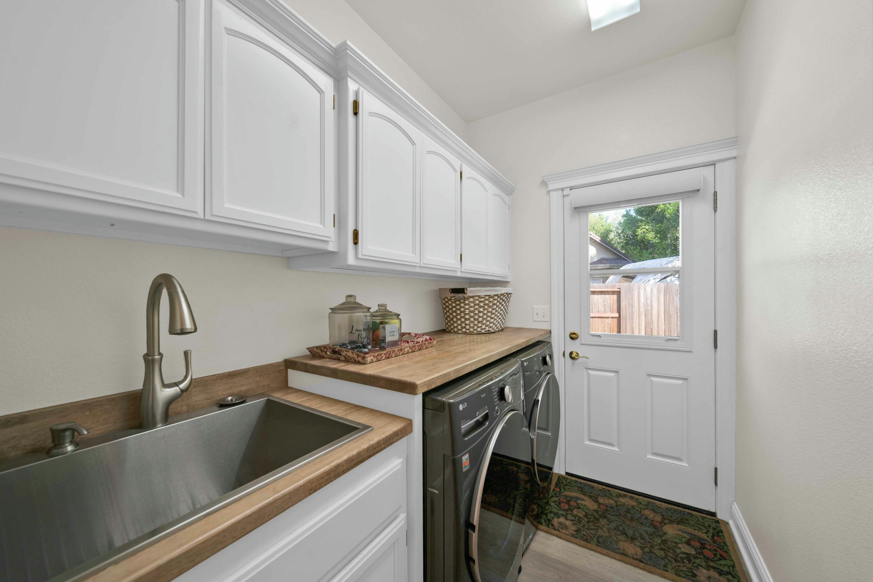 4045 Mt Whitney Way Redding, CA 96002 - Photo 36 of 78 a kitchen with stainless steel appliances granite countertop a sink stove and cabinets