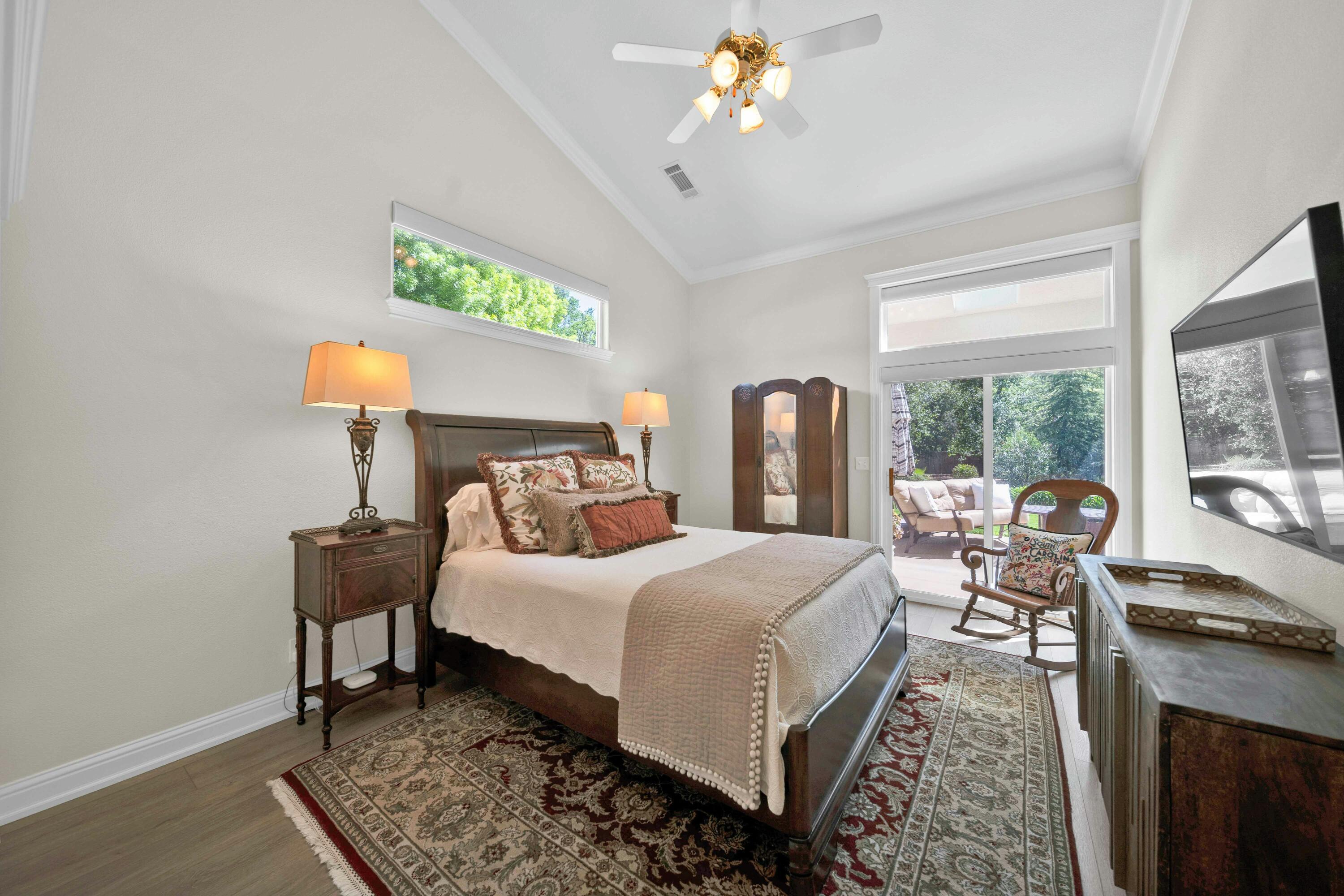4045 Mt Whitney Way Redding, CA 96002 - Photo 40 of 78 a bedroom with a bed and a chandelier