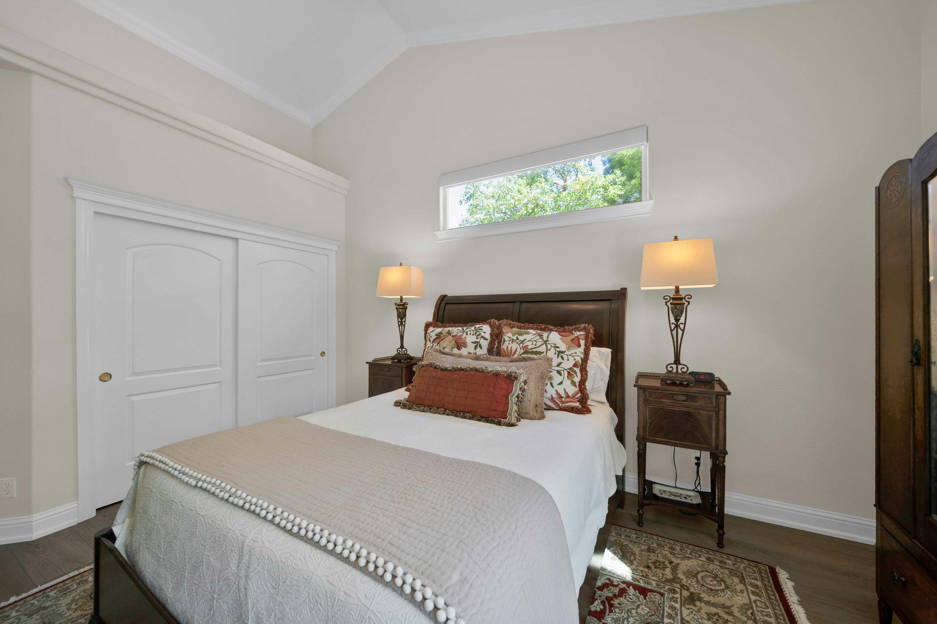 4045 Mt Whitney Way Redding, CA 96002 - Photo 42 of 78 a bedroom with a bed and a lamp on table