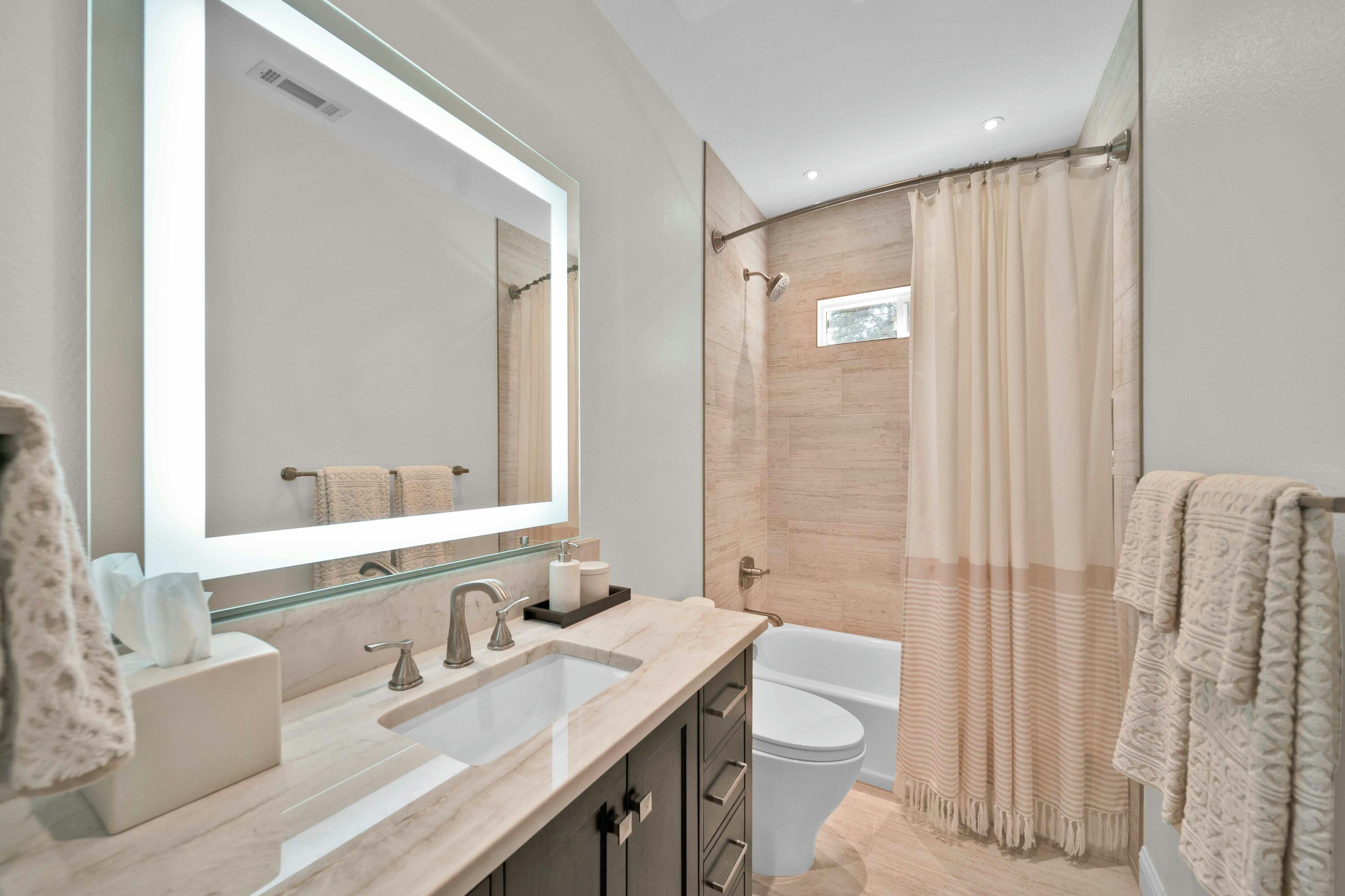 4045 Mt Whitney Way Redding, CA 96002 - Photo 47 of 78 a bathroom with a granite countertop sink toilet and shower