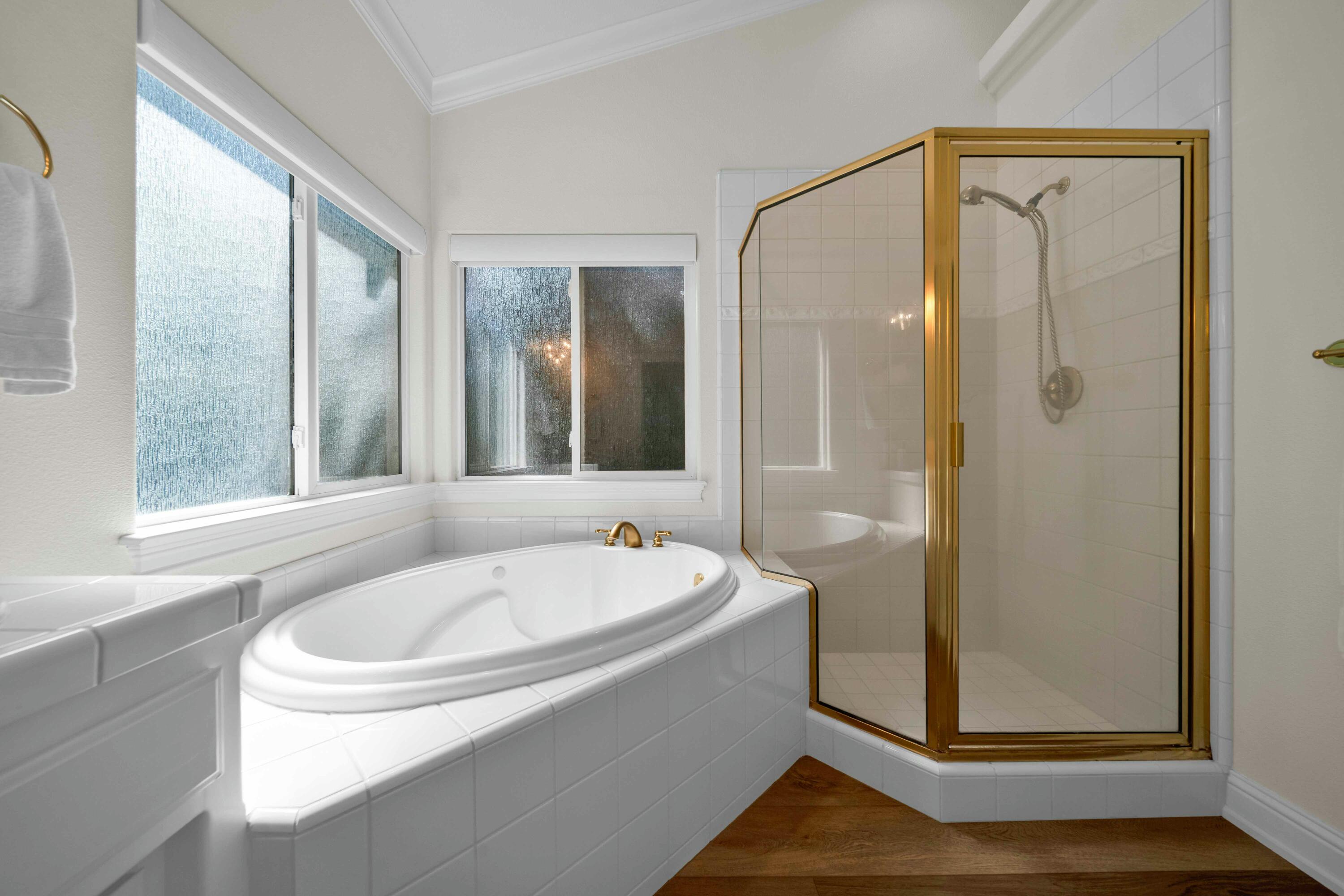 4045 Mt Whitney Way Redding, CA 96002 - Photo 51 of 78 a bathroom with a tub a sink and a window