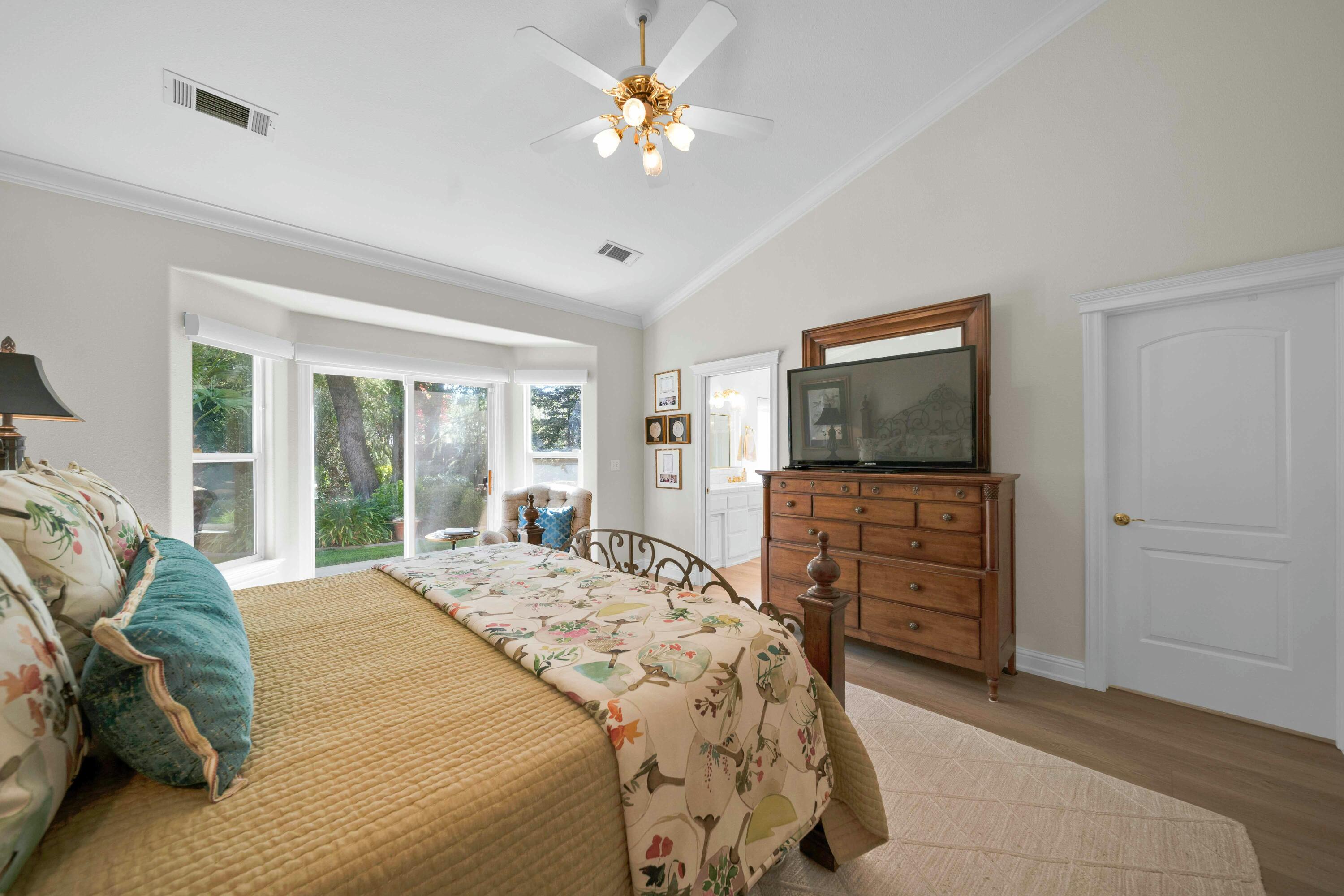 4045 Mt Whitney Way Redding, CA 96002 - Photo 54 of 78 a bedroom with a bed and a flat screen tv