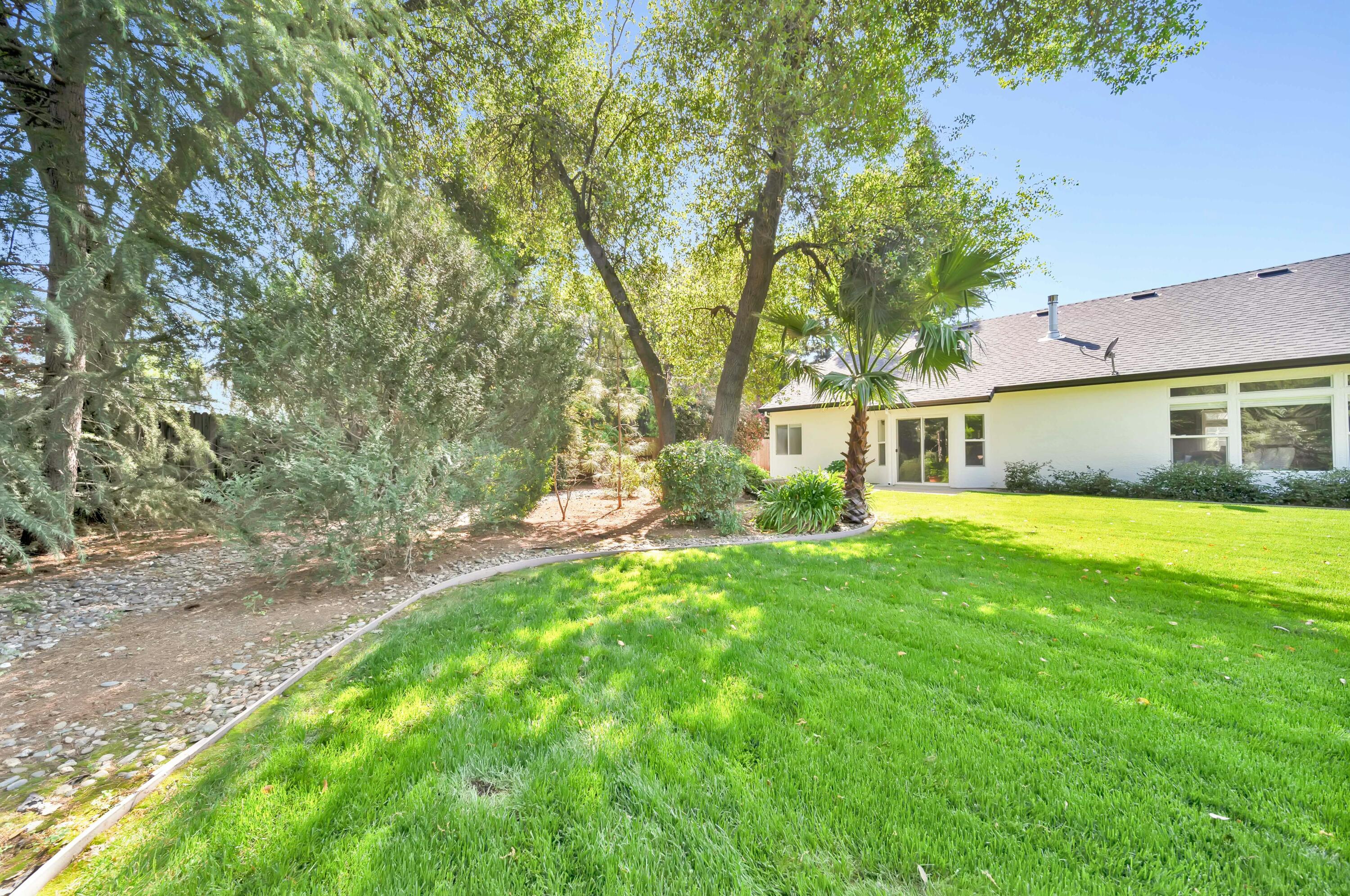 4045 Mt Whitney Way Redding, CA 96002 - Photo 66 of 78 a front view of a house with a garden