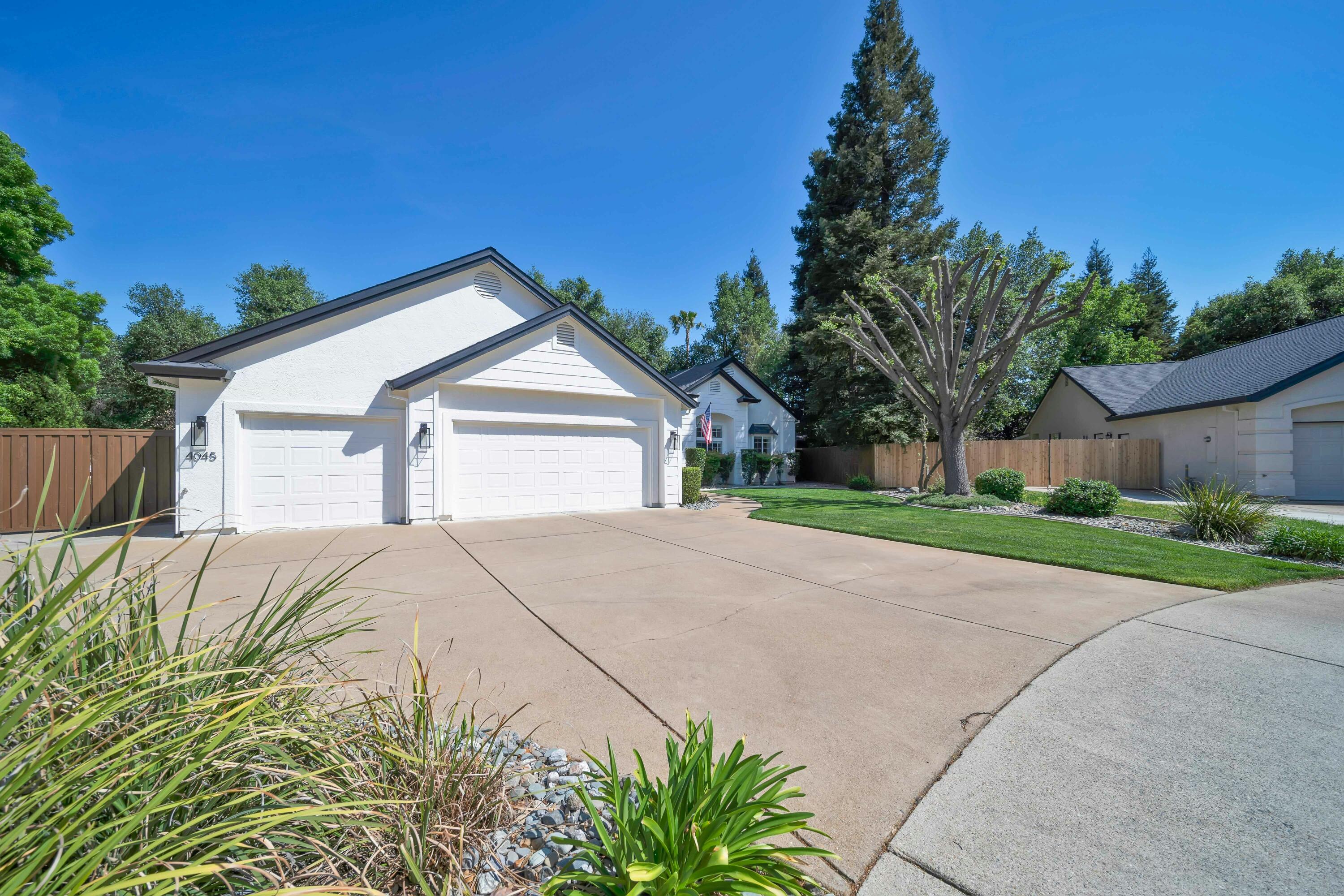 4045 Mt Whitney Way Redding, CA 96002 - Photo 68 of 78 a front view of a house with a yard and garage