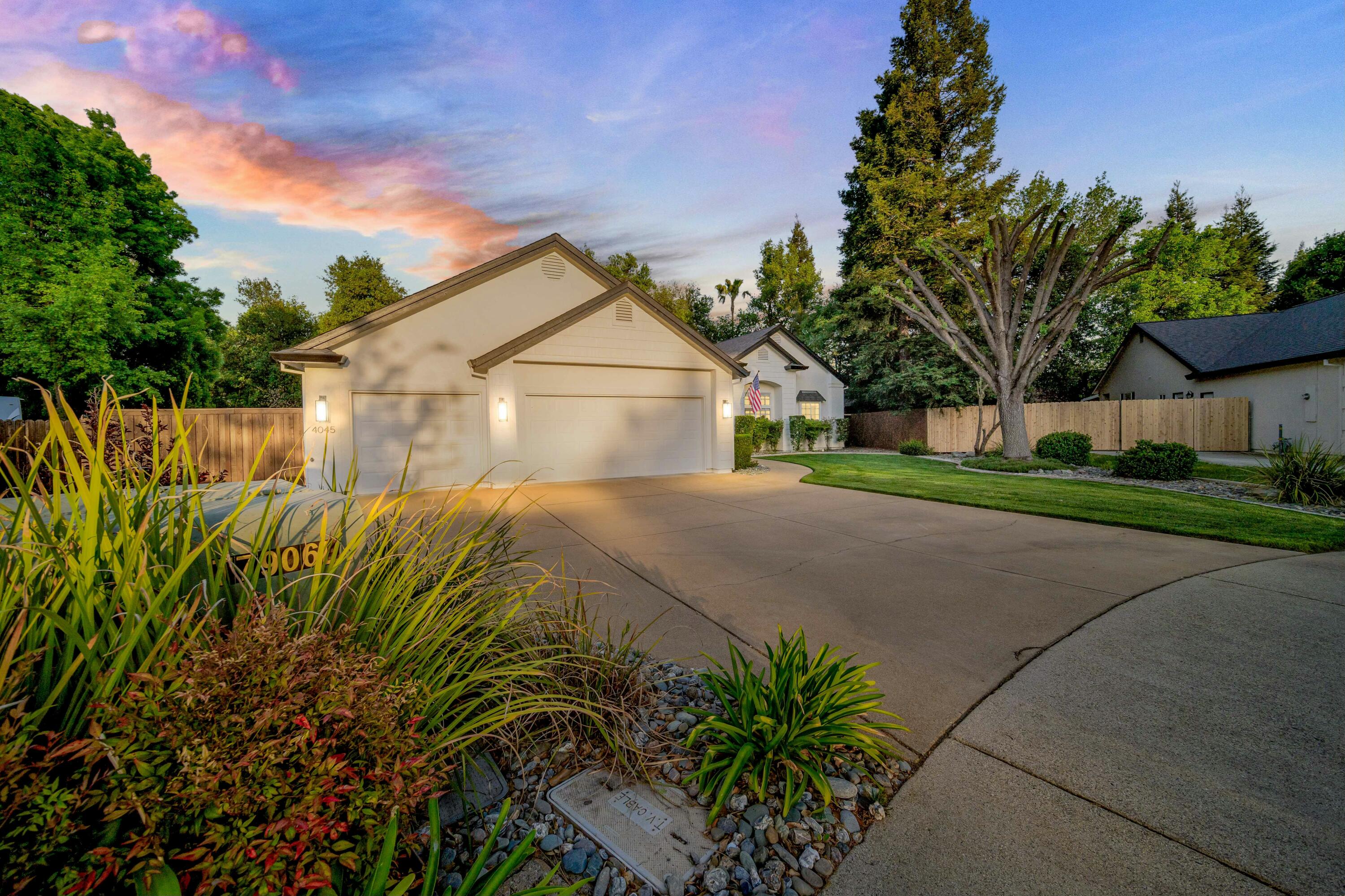 4045 Mt Whitney Way Redding, CA 96002 - Photo 71 of 78 a front view of a house with a yard and garage