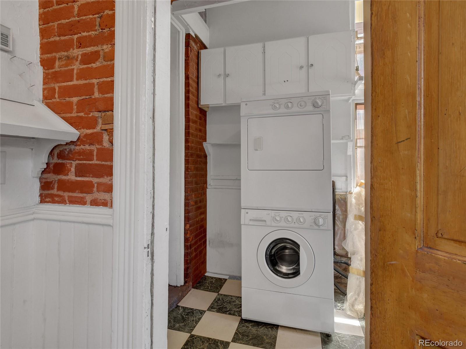 3349 Tejon Street Denver, CO 80211 - Photo 12 of 37 a utility room with dryer and washer