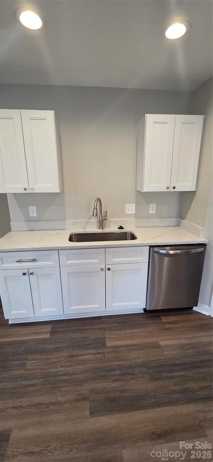 513 Lincolnton Road Salisbury, NC 28144 - Photo 3 of 11 a kitchen with a sink cabinets and a wooden floor