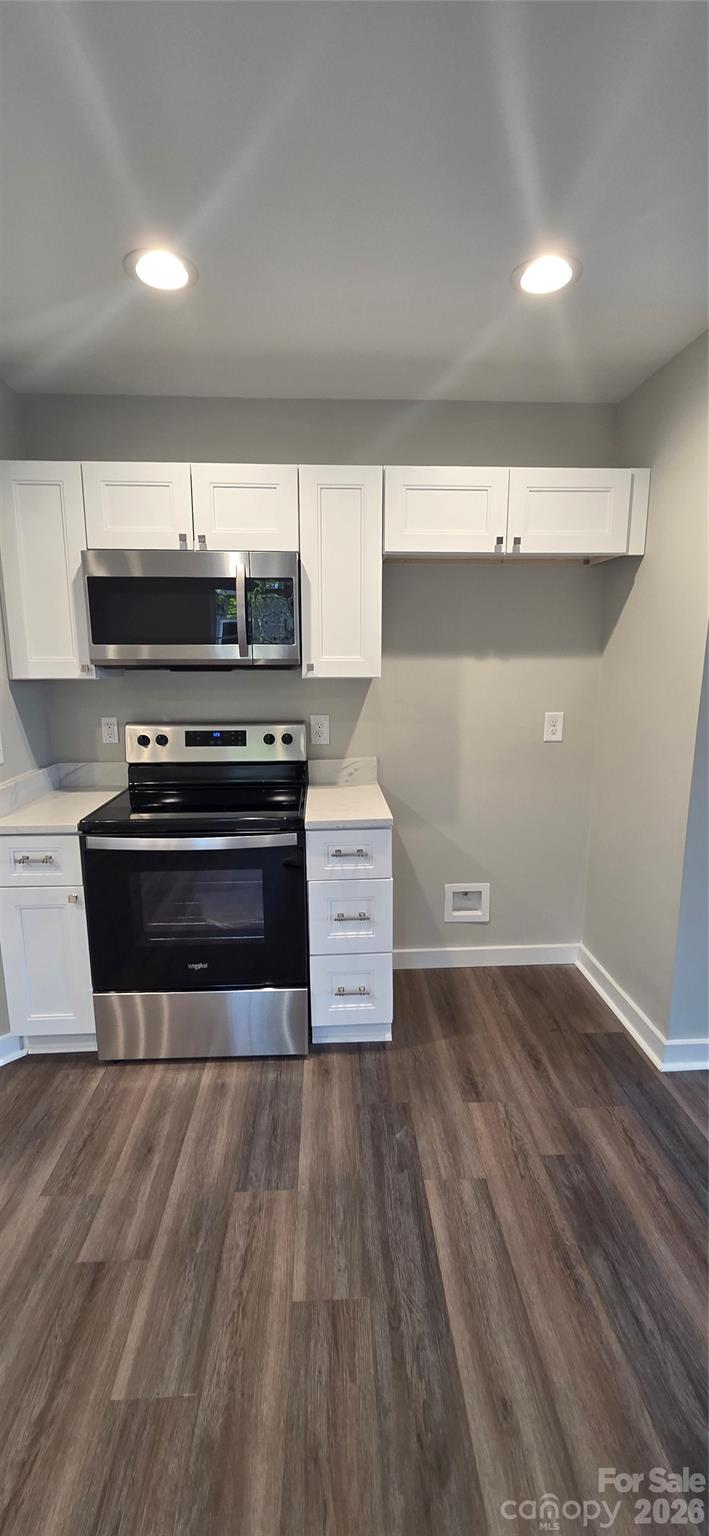 513 Lincolnton Road Salisbury, NC 28144 - Photo 4 of 11 a view of kitchen with wooden floor and stainless steel appliances
