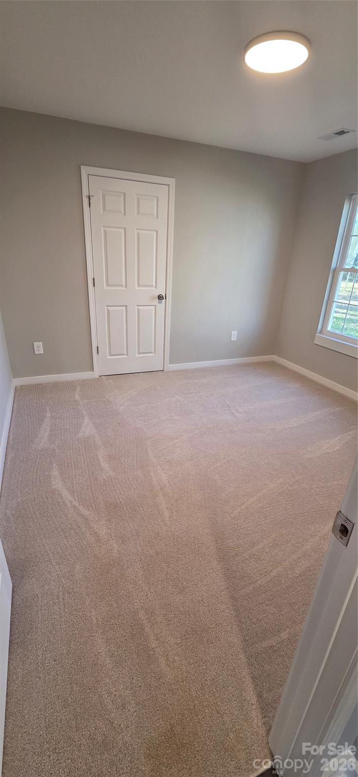 513 Lincolnton Road Salisbury, NC 28144 - Photo 5 of 11 an empty room with windows and closet