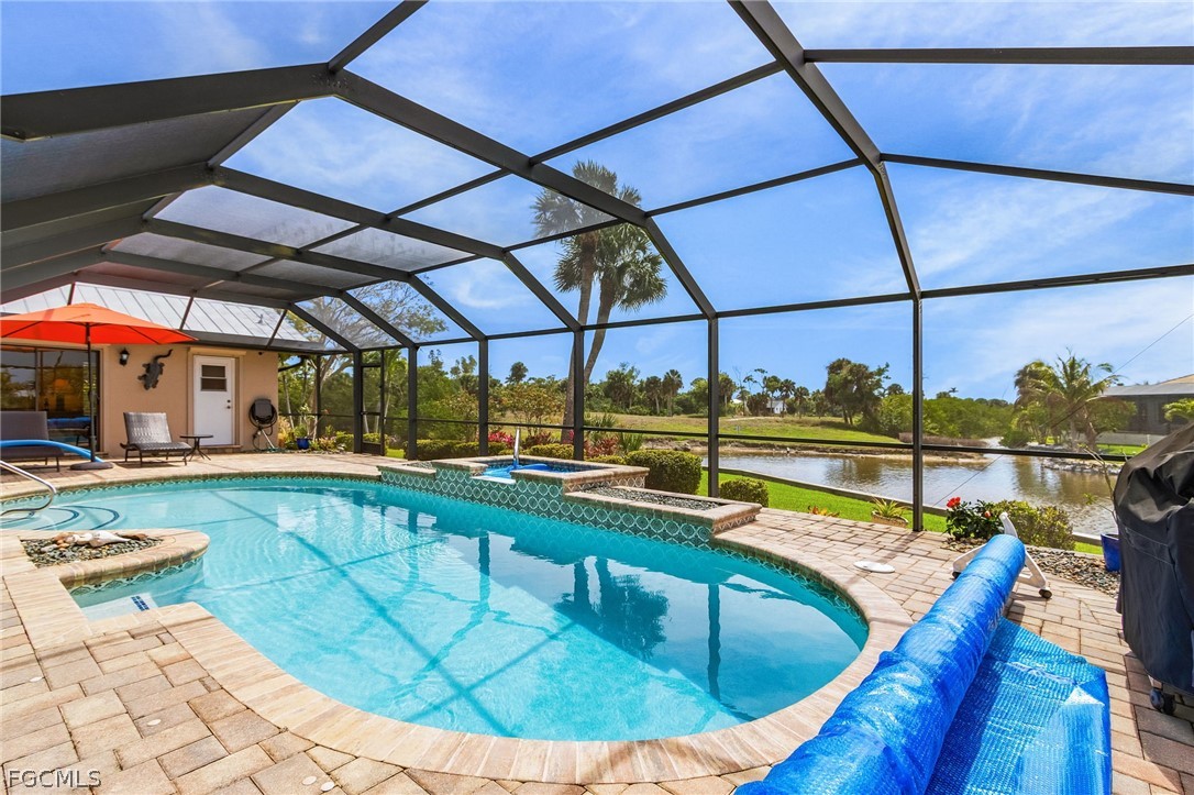 7747 Grande Pine Road Bokeelia, FL 33922 - Photo 36 of 45 a view of a swimming pool with a patio