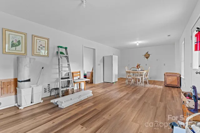 a view of a room with furniture window and wooden floor