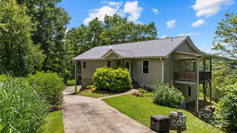 a view of a forest from a balcony