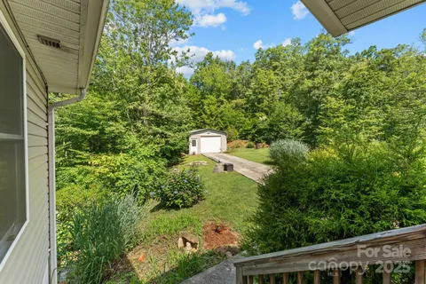 a view of a mountain range with lush green forest