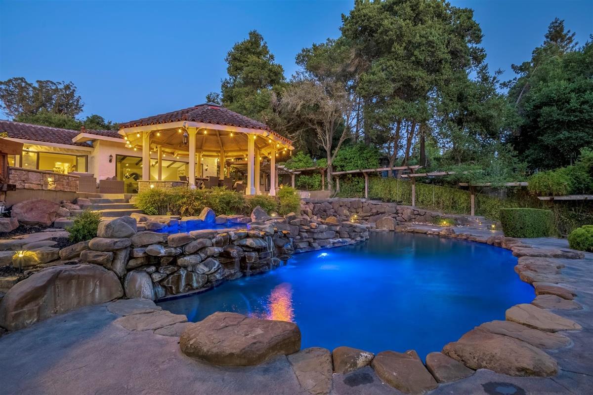 14355 Quito Road Saratoga, CA 95070 - Photo 11 of 50 a view of a swimming pool with lawn chairs and potted plants