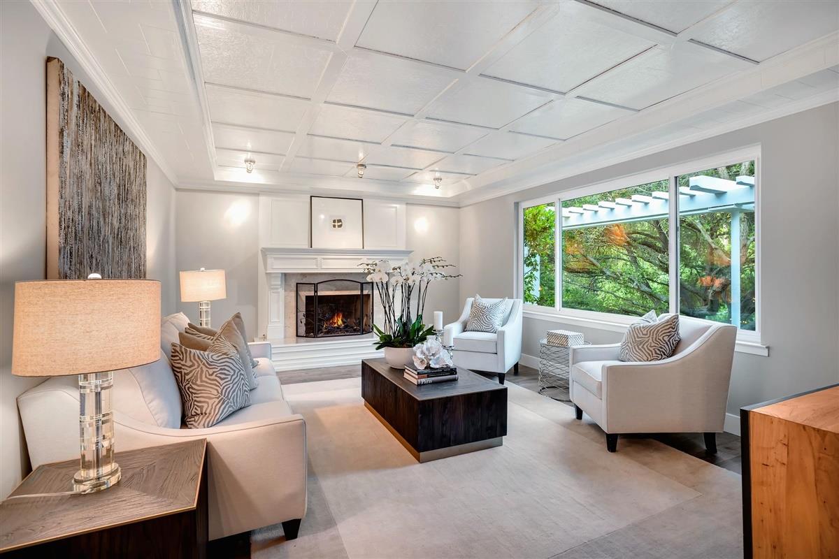 14355 Quito Road Saratoga, CA 95070 - Photo 22 of 50 a living room with furniture and a fireplace