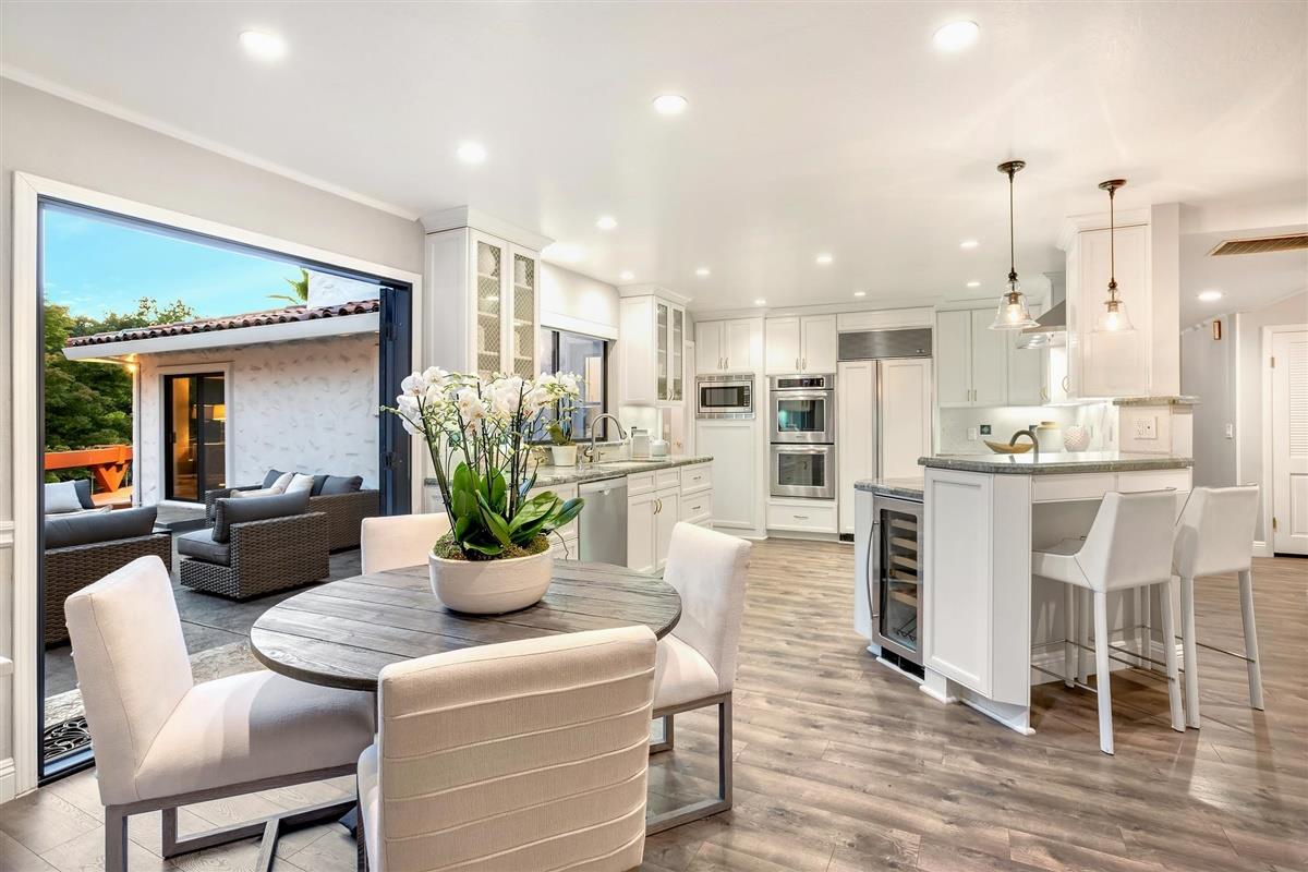 14355 Quito Road Saratoga, CA 95070 - Photo 28 of 50 a kitchen with a table and chairs