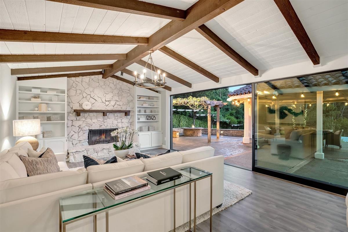 14355 Quito Road Saratoga, CA 95070 - Photo 32 of 50 a living room with fireplace furniture and a floor to ceiling window