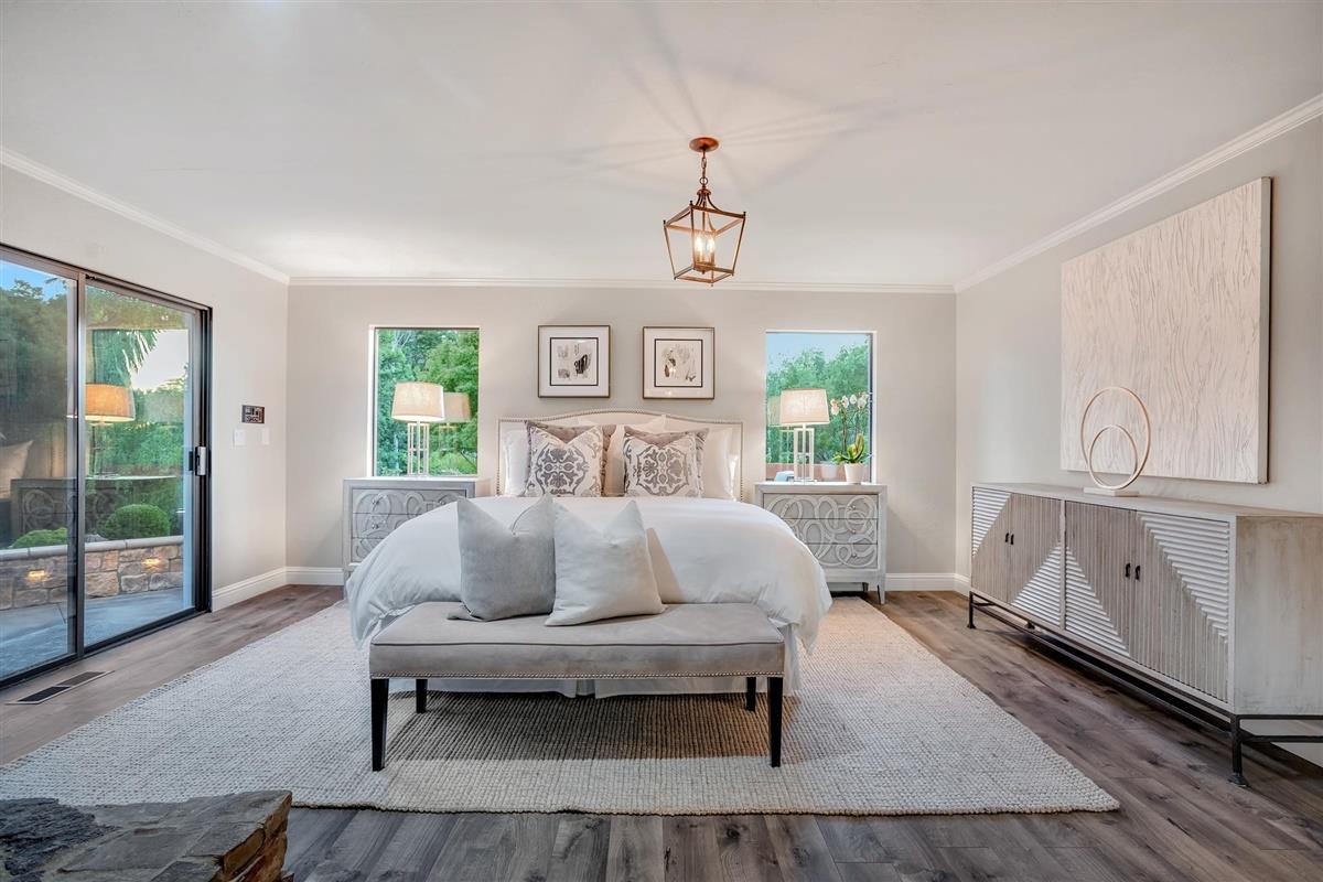 14355 Quito Road Saratoga, CA 95070 - Photo 33 of 50 a bedroom with a bed and wooden floor