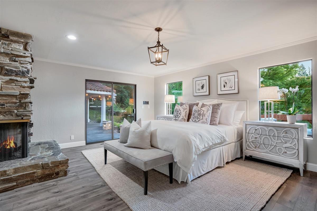 14355 Quito Road Saratoga, CA 95070 - Photo 34 of 50 a spacious bedroom with a bed and a window