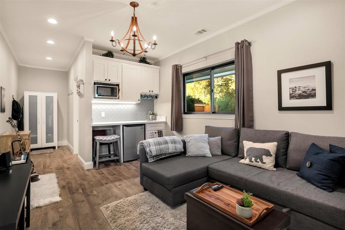 14355 Quito Road Saratoga, CA 95070 - Photo 43 of 50 a living room with furniture window and kitchen view