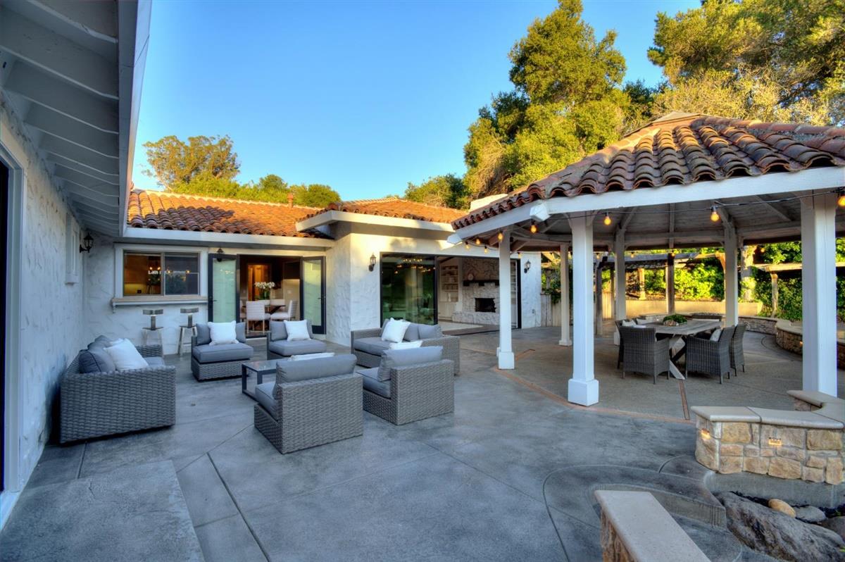 14355 Quito Road Saratoga, CA 95070 - Photo 49 of 50 a view of a patio with couches table and chairs and potted plants