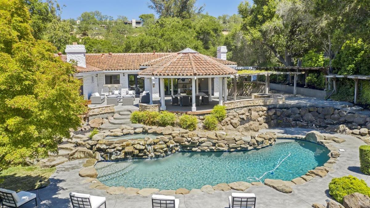 14355 Quito Road Saratoga, CA 95070 - Photo 7 of 50 a front view of a house with garden