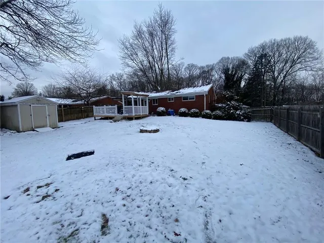 a view of a backyard of the house