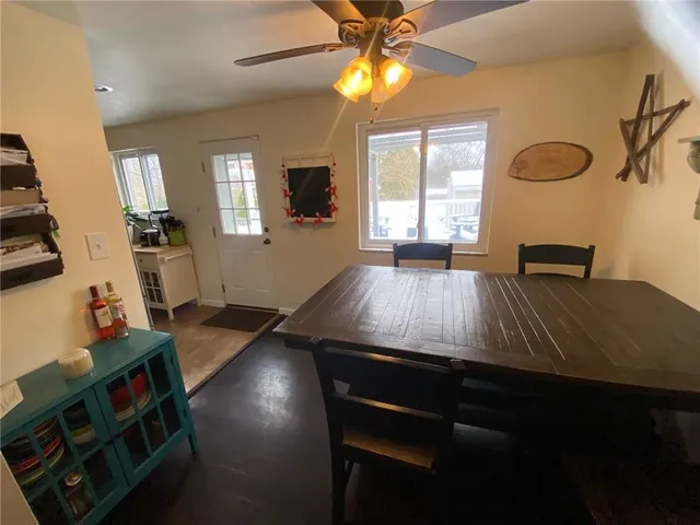 a view of kitchen and dining room with wooden floor