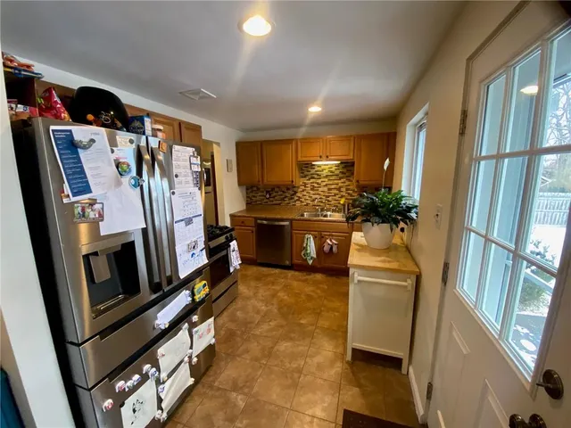 a view of a living room with furniture and a flat screen tv