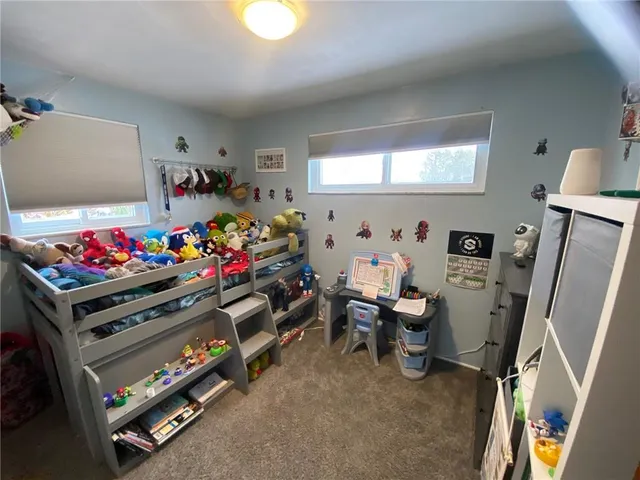 a room with furniture and a flat screen tv