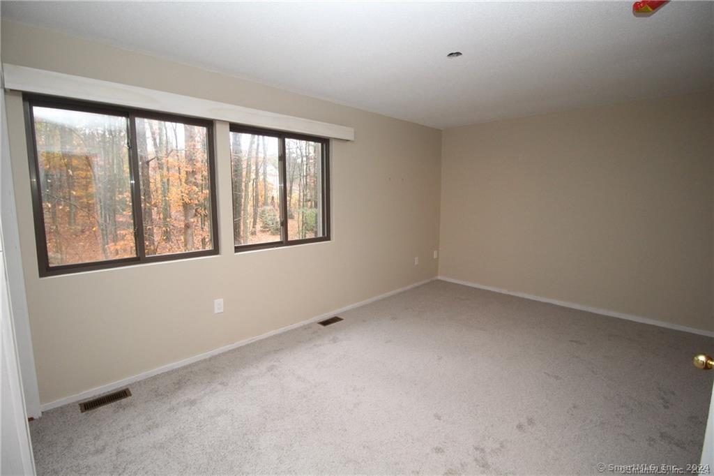 7 Woods Way, Unit 7 Woodbury, CT 06798 - Photo 12 of 19 a view of an empty room with a window