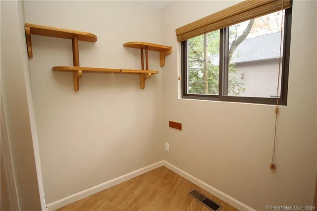 a view of a room with rack on the wall