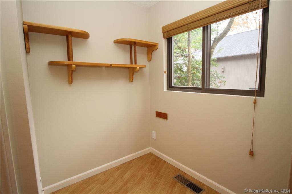7 Woods Way, Unit 7 Woodbury, CT 06798 - Photo 5 of 19 a view of a room with rack on the wall
