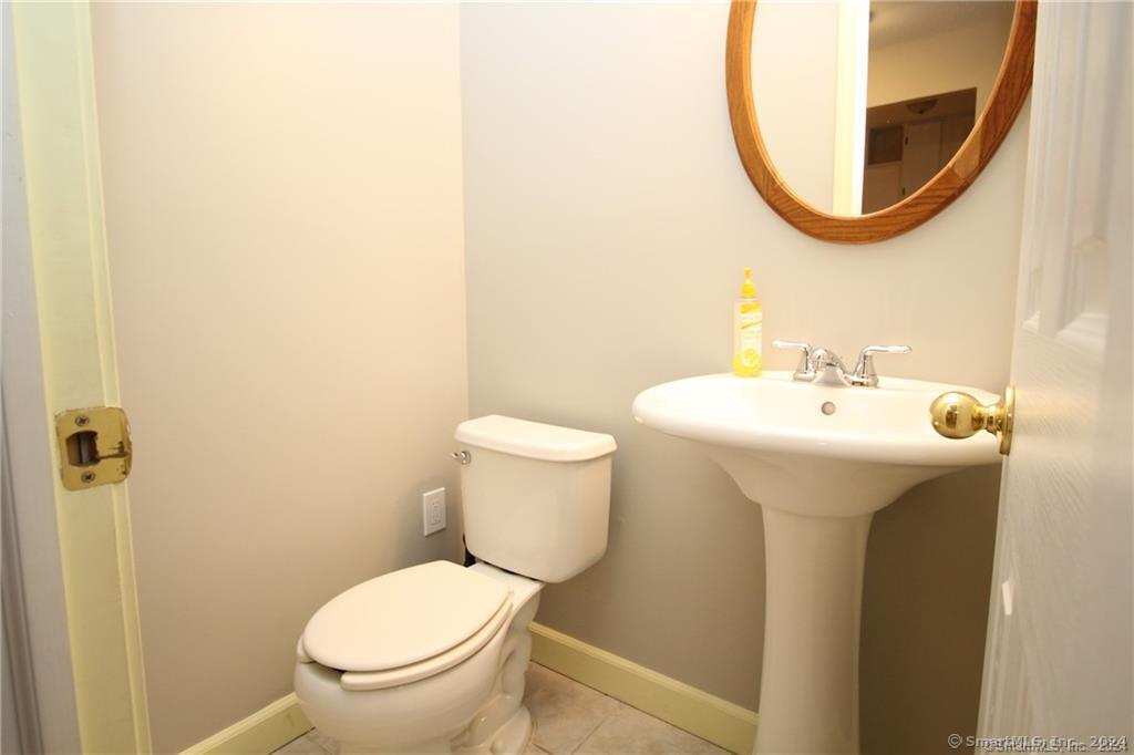 7 Woods Way, Unit 7 Woodbury, CT 06798 - Photo 6 of 19 a bathroom with a sink and a mirror