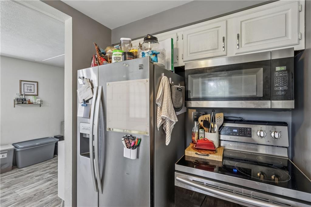 550 McClane Farm Road Washington, PA 15301 - Photo 13 of 31 a utility room with stainless steel appliances and cabinets