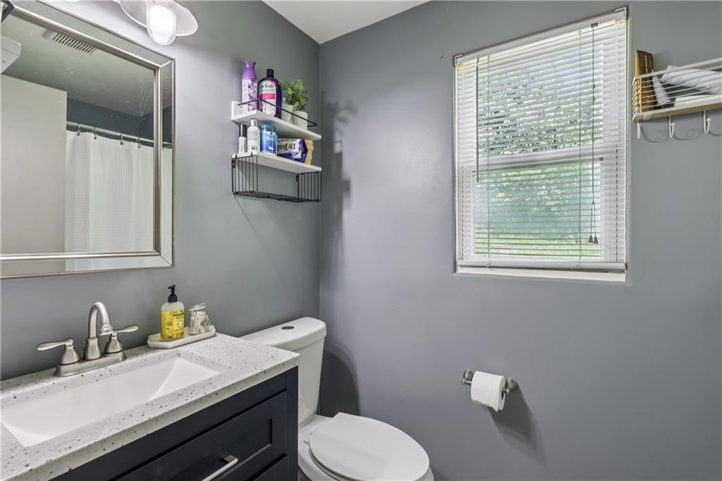 550 McClane Farm Road Washington, PA 15301 - Photo 17 of 31 a bathroom with a sink vanity mirror and toilet