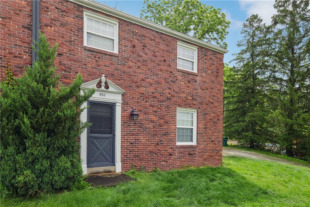 550 McClane Farm Road Washington, PA 15301 - Photo 3 of 31 a view of a brick house with a yard