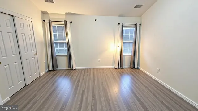 a view of a livingroom with wooden floor