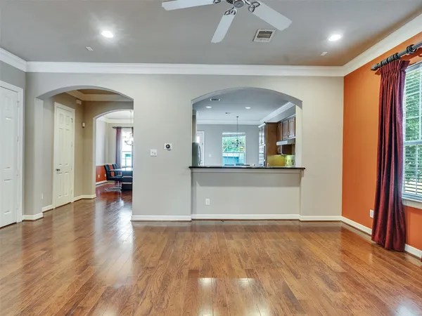 wooden floor in a room with a large window