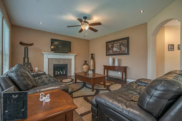 a living room with furniture and a fireplace